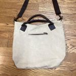 Classic Fashion Outback bag. Tan with pebbled leather handles and trim. Photo 1