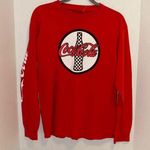 Coca-Cola  RED LONG SLEEVE TEE SHIRT
WITH GRAPHIC DESIGN ON FRONT SIZE MEDIUM Photo 0