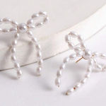 Elegant Pearl Bow Earrings White Photo 0