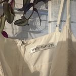 Saints + Secrets Romper Photo 1