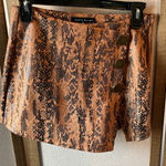 Haute Monde  Black and Orange Patterned pleather skort small Photo 0