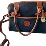 Dooney & Bourke Vintage Buckle Black/Tan Pebbled All Weather Leather purse Photo 1