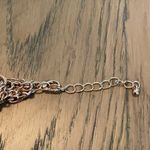 Elegant Gold Layered Necklace with Floral Accents Photo 2