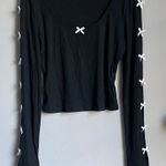 Chic Black Long Sleeve Top with White Bow Details Size M Photo 0