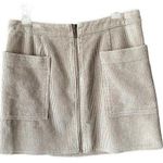Corduroy front zipper beige mini skirt. Size large. Photo 0