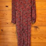 Free People  Some Like It Hot Long Sleeve V-Neck Jumpsuit in Rust Combo Photo 3