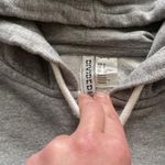 Athleta  black capri leggings, size small paired with H&M Hoodie S Photo 2