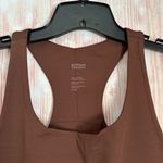 Girlfriend Collective • Designed for medium impact activities • Double lined, sweat-wicking material with four way stretch • Racerback • Scoop neck • Built-in support band • Form-hugging fit • Poly/spandex blend Photo 5