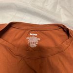 SKIMS  burnt orange shirt Photo 1