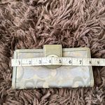 Coach  Silver/Gray and tan signature Turnlock wallet with purple lining Photo 11