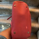 Dana Buchman pink leather purse with handles and shoulder strap. Pockets inside Photo 1