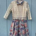 Collared dress with sheer embroidered lace sleeves and pleated skirt Size 6 Photo 0