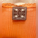 Free People  orange peasant top with lace and ruffle trim Photo 1