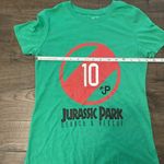 Women’s Green Jurassic Park Search & Rescue Short Sleeve Baby Tee, Size Medium Photo 1