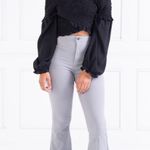 Ambiance Apparel NWOT Ambiance Black Criss Cross Smock bell Sleeve Top. Size Medium Photo 1