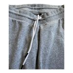 Under Armour Womens grey sweatpants, drawstring waist, logo down side of pants, excellent condition, size small Measurements: Waist: side to side 15 inches Inseam: 28 inches Photo 2