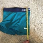 Nike Pro woman’s size XS teal and navy shorts Photo 5