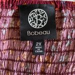 Bobeau BABEAU Beautiful red floral babydoll top, smocked top, long puffy sleeves, excellent condition,  Size 2x Measurements: Bust: armpit to armpit 19-25 inches  Length: shoulder seam to bottom 30 inches  Photo 8