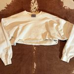 Hanes Cropped white  sweatshirt best fits a small  Was cropped by me so keep that in mind it has a raw hem! Photo 0