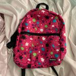 pink paint splattered backpack Photo 0