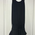 Edara NWT  The Signature Ruffle Dress Size Small . This one does not come with the sport bra as seen on the stock picture.   The criss-cross back of the Ruffle Dress gives non-restrictive mobility and is effortless to pull on and take off. A wide waistband anchors the relaxed fit of the bodice, which drapes loosely to create a flattering and comfortable midsection for diverse body types. Pair this dress with an Advantage Sports Bra and coordinating Ace Visor for a complete, finished look. Photo 4