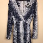 Angie NWT Women’s Snakeskin Print Faux Wrap Keyhole Back Long Sleeve Romper Photo 0