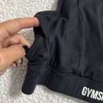 Gymshark  non stop sports bra black size medium size pocket zips front clasps bck Photo 2