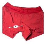 Lululemon Speed Up Short with a 4" inseam in Flamenco Red Swift Photo 6