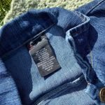 Denim blue floral dress
Fits like a women’s small S Photo 1