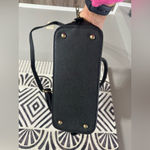 Black Handbag with Gold Accents Photo 7