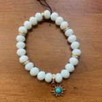 Juicy Couture  Stretch White Beaded Charm Bracelet with Teal/Turquoise Charm Photo 1