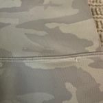 Lululemon Grey camo  leggings. size 4. one minor flaw. see photo. Photo 2