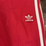 Adidas Red  track pants size xs Photo 2