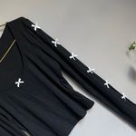 Chic Black Long Sleeve Top with White Bow Details Size M Photo 1