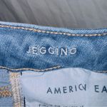 American Eagle  Medium Wash Next Level Stretch Mid Rise Distressed Jegging Jean Photo 4