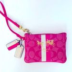 Coach  wristlet with iconic horse and carriage logo. Photo 0