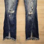{29} KanCan Distressed Blue Jean Split Flare Hem Fringe Detail Photo 4