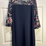 AGB navy dress with sheer floral details at neck and sleeves. Size 10 Photo 1