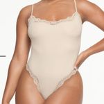 SKIMS  Fits Everybody Corded Lace Bodysuit Photo 0