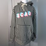 Chic Houndstooth Hoodie with Graphic Detail Black Photo 1