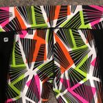 Fabletics tribal penzy print capri legging jogger in neon orange, pink and green Photo 3