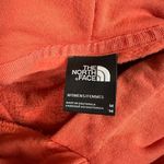 The North Face Emberglow Orange Never Stop Exploring Cropped Hooded Sweatshirt Photo 6