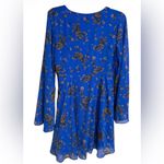 Free People  mini dress in a blue floral pattern with long bell sleeves L Photo 3