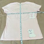 Nirvana  size large fits like a medium light pink short sleeve band T-shirt EUC Photo 4