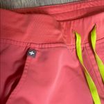 FIGS  Coral Jogger Pants with Neon Accents Photo 1