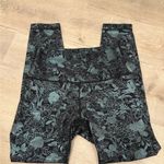 Lululemon Wunder Train High Rise Tight 25” in Logo Flourish Black Foil Photo 1