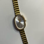Gold Oval Wristwatch with Silver Dial Photo 0