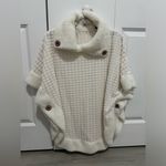 White poncho sweater with cute button detail! Size undefined Photo 1