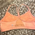 Lululemon  Neon Orange sports bra with mesh panel in back Size 12 no padding Photo 1
