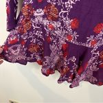 Free People Smooth Talker Purple Floral Open Back Long Sleeved Ruffled Tunic Top Photo 3